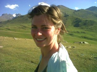 me riding a horse in the mountains